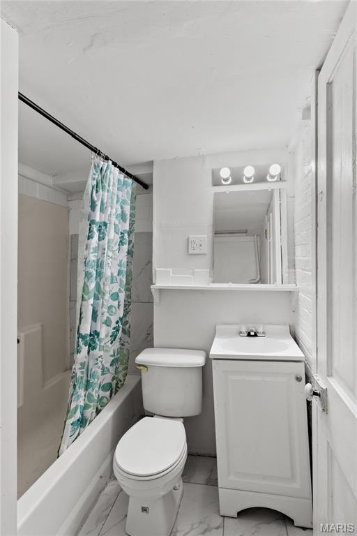 1217 E 5th St, Alton, IL 62002 - full bath with marble look tiles, shower / bathtub combination with curtain, vanity, and toilet