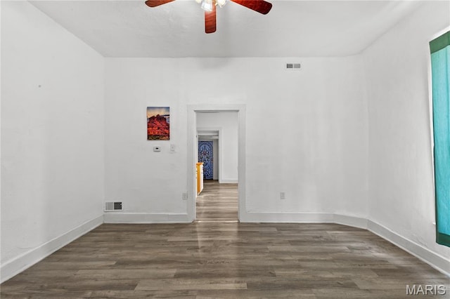 1217 E 5th St, Alton, IL 62002 - empty room with a ceiling fan, wood finished floors, and baseboards