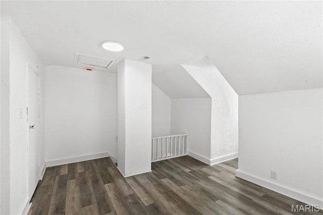 1217 E 5th St, Alton, IL 62002 - additional living space with attic access, wood finished floors, lofted ceiling, and baseboards