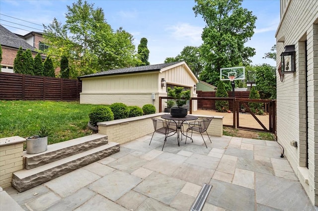 8033 Seminole Dr, Clayton, MO 63105 - view of patio / terrace featuring outdoor dining space and an outbuilding