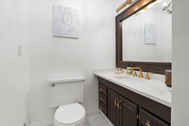 8033 Seminole Dr, Clayton, MO 63105 - bathroom with baseboards, vanity, and toilet