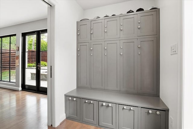 8033 Seminole Dr, Clayton, MO 63105 - mudroom featuring light wood-type flooring, french doors, and baseboards
