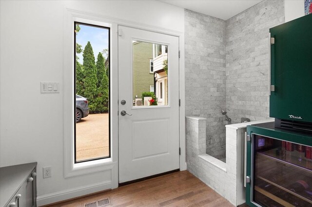 8033 Seminole Dr, Clayton, MO 63105 - entryway with wood finished floors and beverage cooler