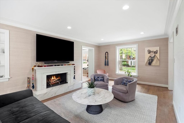 8033 Seminole Dr, Clayton, MO 63105 - living room with crown molding, a fireplace, wood finished floors, baseboards, and recessed lighting
