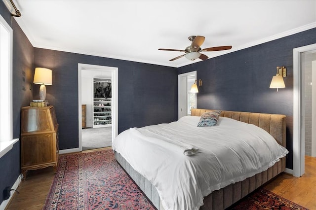 8033 Seminole Dr, Clayton, MO 63105 - bedroom with wood finished floors, crown molding, a ceiling fan, and baseboards
