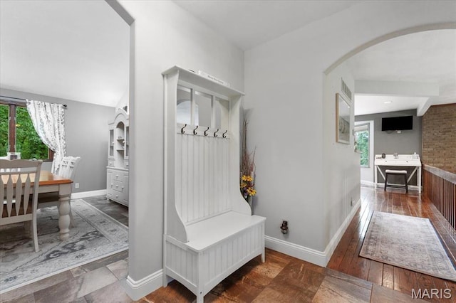 3536 Possum Ridge Dr, Imperial, MO 63052 - mudroom featuring arched walkways, baseboards, and hardwood / wood-style floors
