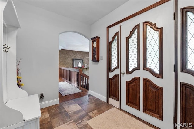 3536 Possum Ridge Dr, Imperial, MO 63052 - entryway featuring arched walkways, baseboards, and stone finish floors