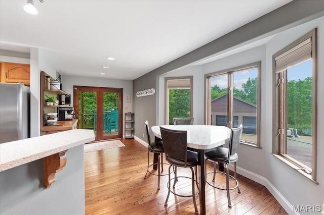 3536 Possum Ridge Dr, Imperial, MO 63052 - dining room with light wood finished floors, baseboards, and recessed lighting