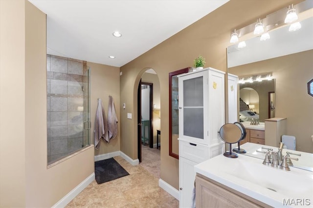 3536 Possum Ridge Dr, Imperial, MO 63052 - full bath featuring vanity, baseboards, tiled shower, recessed lighting, and ensuite bathroom