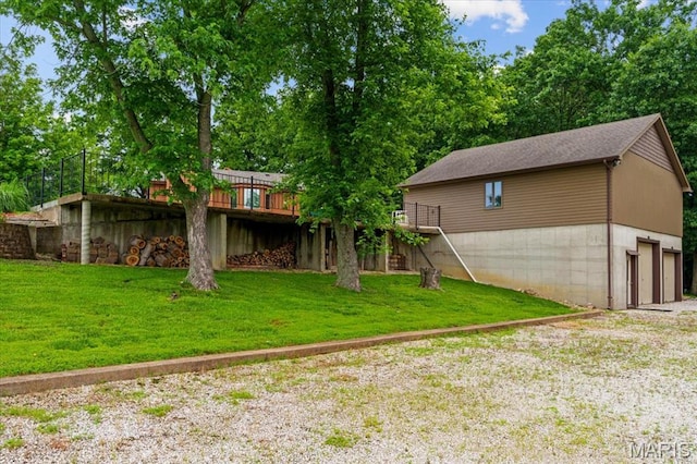 3536 Possum Ridge Dr, Imperial, MO 63052 - view of grassy yard featuring a wooden deck, a garage, and gravel driveway