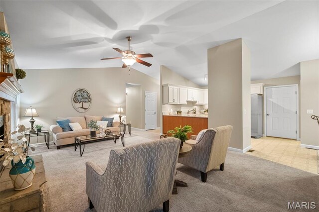 30 Citori Ct, Troy, MO 63379 - living area with light carpet, ceiling fan, a stone fireplace, vaulted ceiling, and baseboards