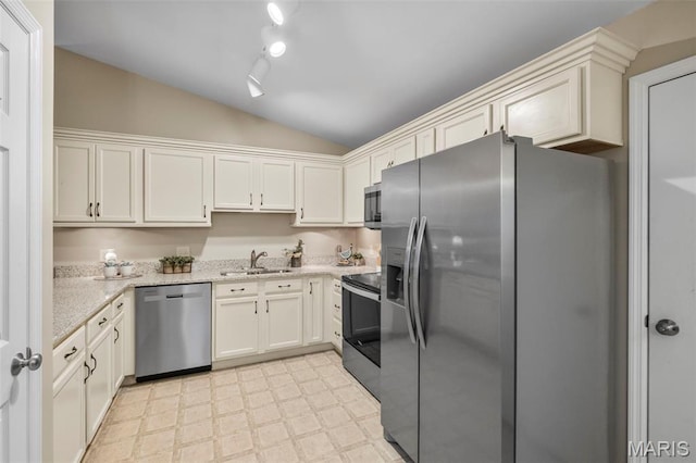 30 Citori Ct, Troy, MO 63379 - kitchen with appliances with stainless steel finishes, vaulted ceiling, light flooring, a sink, and light stone countertops
