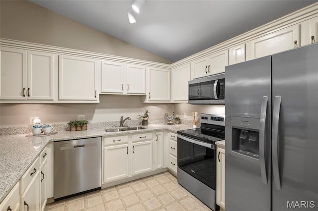 30 Citori Ct, Troy, MO 63379 - kitchen featuring stainless steel appliances, a sink, lofted ceiling, light flooring, and light stone counters