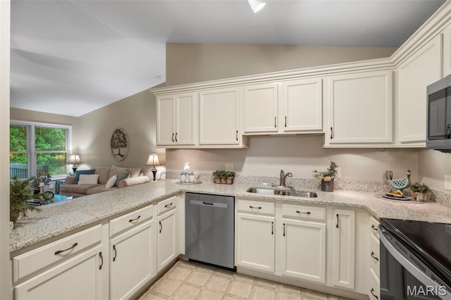30 Citori Ct, Troy, MO 63379 - kitchen with appliances with stainless steel finishes, lofted ceiling, a sink, white cabinets, and light stone counters