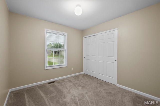 30 Citori Ct, Troy, MO 63379 - unfurnished bedroom featuring baseboards, carpet floors, and a closet