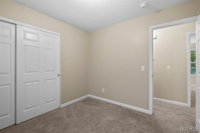 30 Citori Ct, Troy, MO 63379 - unfurnished bedroom featuring carpet flooring, baseboards, and a closet