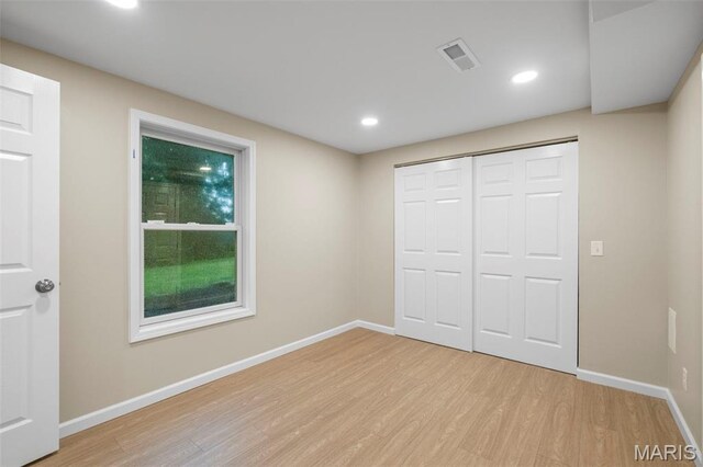 30 Citori Ct, Troy, MO 63379 - unfurnished bedroom featuring light wood-style flooring, baseboards, recessed lighting, and a closet