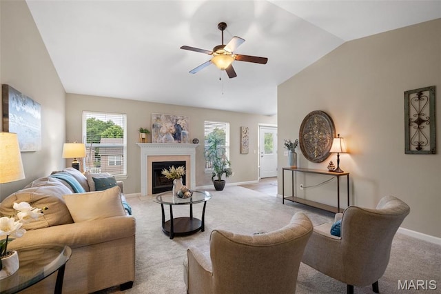 171 Majestic Lakes Blvd, Moscow Mills, MO 63362 - living room with vaulted ceiling, ceiling fan, light carpet, baseboards, and a fireplace