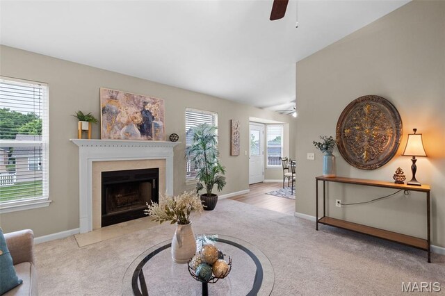 171 Majestic Lakes Blvd, Moscow Mills, MO 63362 - living area with a ceiling fan, carpet flooring, baseboards, and a fireplace with flush hearth