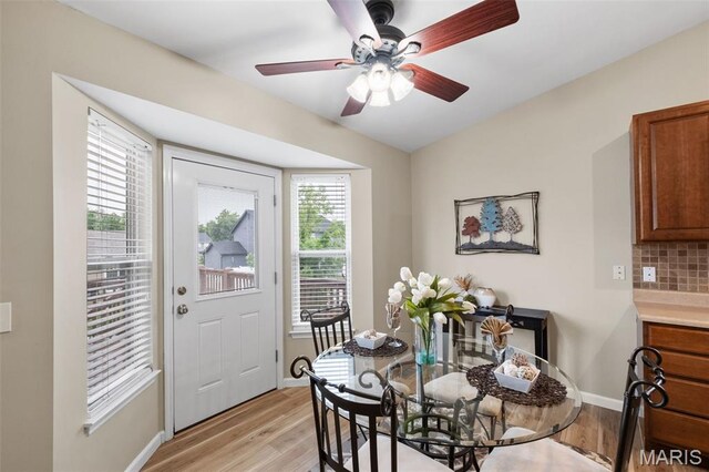 171 Majestic Lakes Blvd, Moscow Mills, MO 63362 - dining room with light wood-type flooring, ceiling fan, and baseboards