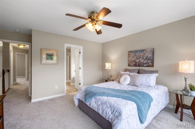 171 Majestic Lakes Blvd, Moscow Mills, MO 63362 - bedroom featuring light carpet, baseboards, ceiling fan, and ensuite bath