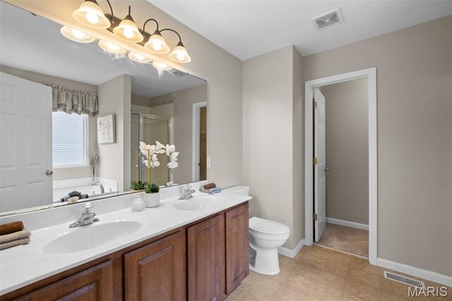 171 Majestic Lakes Blvd, Moscow Mills, MO 63362 - bathroom with a shower stall, toilet, a garden tub, double vanity, and baseboards