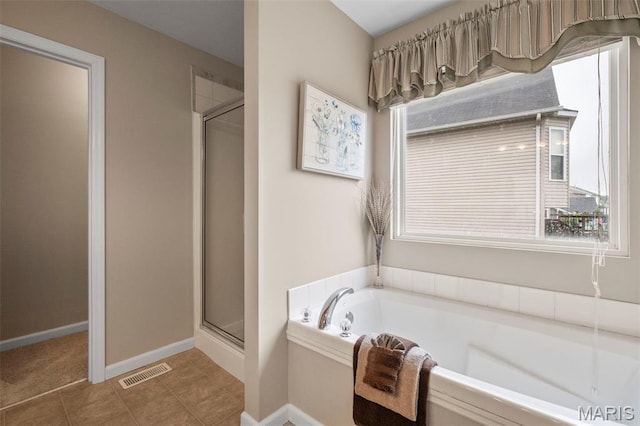 171 Majestic Lakes Blvd, Moscow Mills, MO 63362 - bathroom with a stall shower, a bath, healthy amount of natural light, and baseboards
