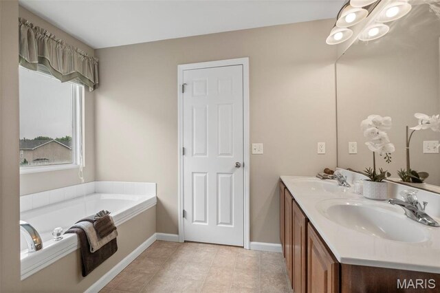 171 Majestic Lakes Blvd, Moscow Mills, MO 63362 - full bathroom featuring double vanity, a bath, baseboards, and tile patterned flooring