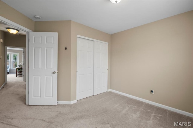 171 Majestic Lakes Blvd, Moscow Mills, MO 63362 - unfurnished bedroom featuring carpet floors, baseboards, and a closet