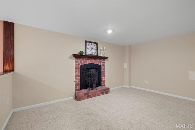 171 Majestic Lakes Blvd, Moscow Mills, MO 63362 - unfurnished living room featuring a brick fireplace, carpet floors, and baseboards