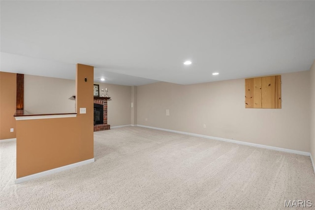 171 Majestic Lakes Blvd, Moscow Mills, MO 63362 - unfurnished living room featuring light carpet, a brick fireplace, baseboards, and recessed lighting
