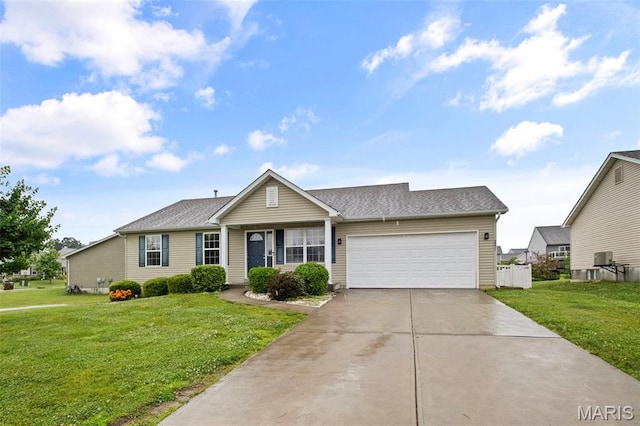 2231 Central Park Dr, Troy, MO 63379 - view of front of home featuring an attached garage, a front yard, and concrete driveway
