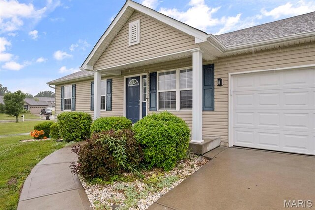 2231 Central Park Dr, Troy, MO 63379 - view of front of property with an attached garage, a front yard, roof with shingles, and asphalt driveway