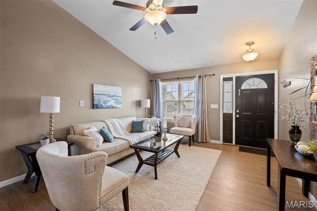 2231 Central Park Dr, Troy, MO 63379 - living room featuring light wood finished floors, ceiling fan, high vaulted ceiling, and baseboards