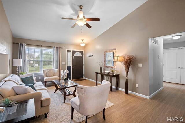 2231 Central Park Dr, Troy, MO 63379 - living room featuring light wood finished floors, a ceiling fan, baseboards, and high vaulted ceiling