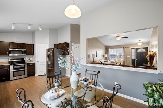 2231 Central Park Dr, Troy, MO 63379 - dining area featuring light wood-type flooring, ceiling fan, track lighting, and baseboards