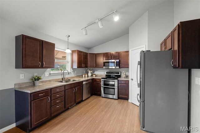 2231 Central Park Dr, Troy, MO 63379 - kitchen featuring stainless steel appliances, a sink, light wood-style floors, vaulted ceiling, and rail lighting