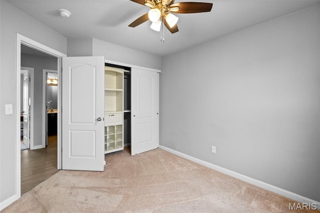 2231 Central Park Dr, Troy, MO 63379 - unfurnished bedroom with carpet flooring, baseboards, a closet, and a ceiling fan