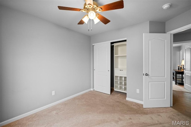 2231 Central Park Dr, Troy, MO 63379 - unfurnished bedroom featuring carpet floors, baseboards, a closet, and a ceiling fan
