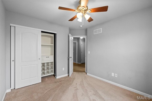 2231 Central Park Dr, Troy, MO 63379 - unfurnished bedroom featuring carpet flooring, a closet, baseboards, and a ceiling fan