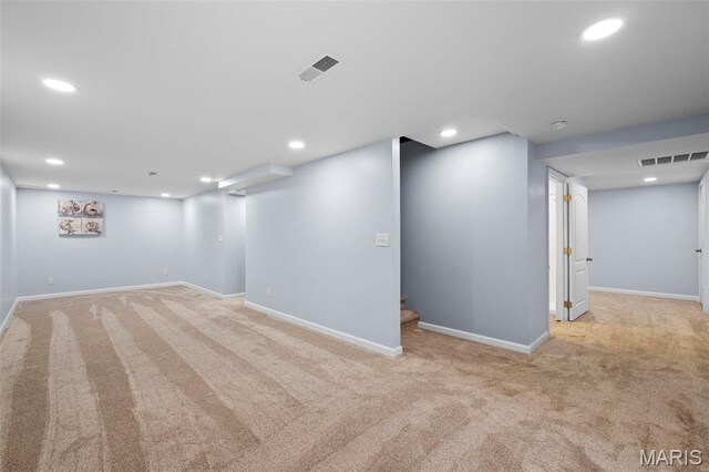 2231 Central Park Dr, Troy, MO 63379 - finished below grade area with carpet floors, baseboards, recessed lighting, and stairway