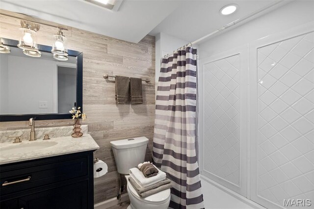 2231 Central Park Dr, Troy, MO 63379 - bathroom with toilet, vanity, wooden walls, and a shower with shower curtain
