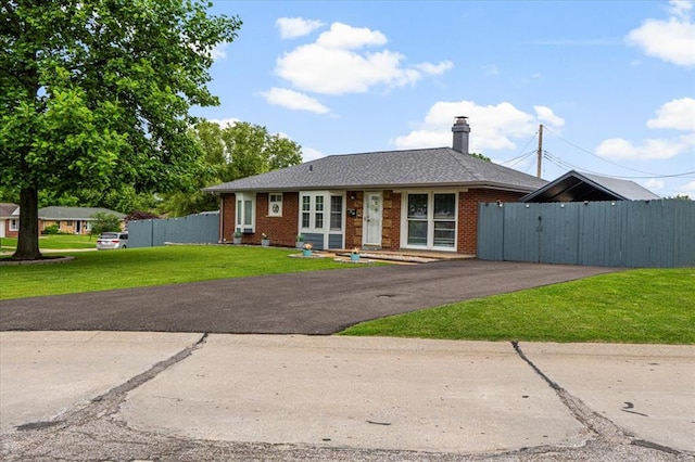 9513 Sequoia Ct, Affton, MO 63123 - view of front facade with brick siding, a chimney, and driveway
