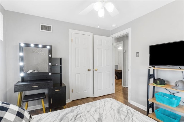 9513 Sequoia Ct, Affton, MO 63123 - bedroom with wood finished floors, baseboards, ceiling fan, and a closet