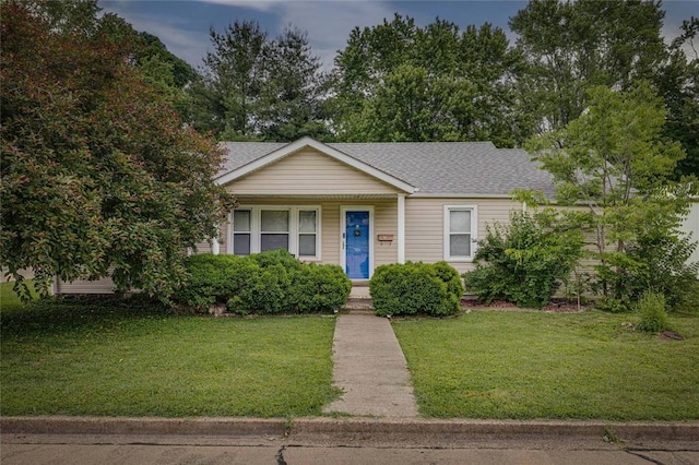 701 E Liberty St, Farmington, MO 63640 - view of front facade featuring a front lawn and roof with shingles