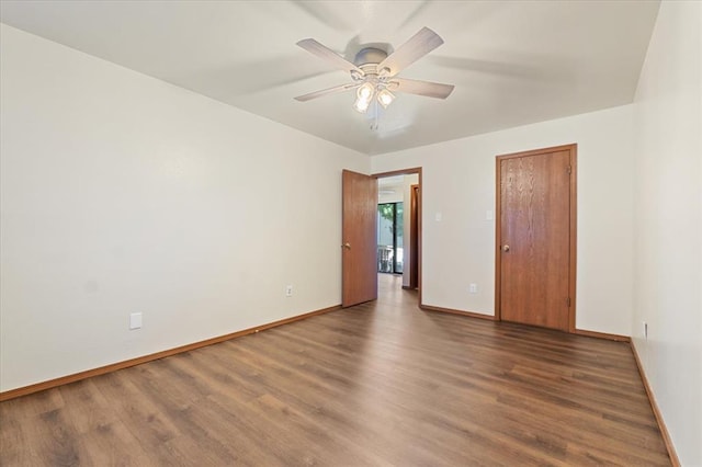 2032 New Sun Dr, Florissant, MO 63031 - empty room with wood finished floors, baseboards, and ceiling fan