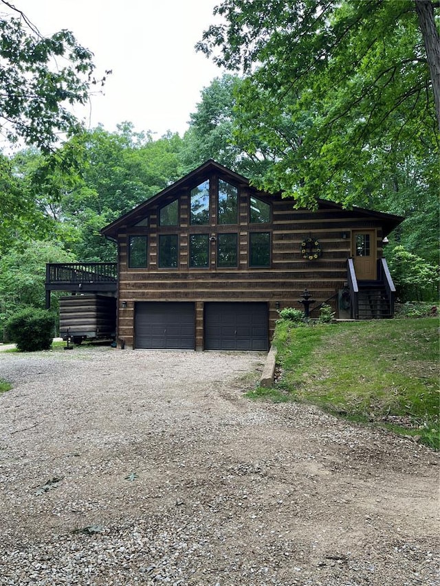 16453 Scenic Ridge Rd, Marthasville, MO 63357 - log home with a garage and driveway