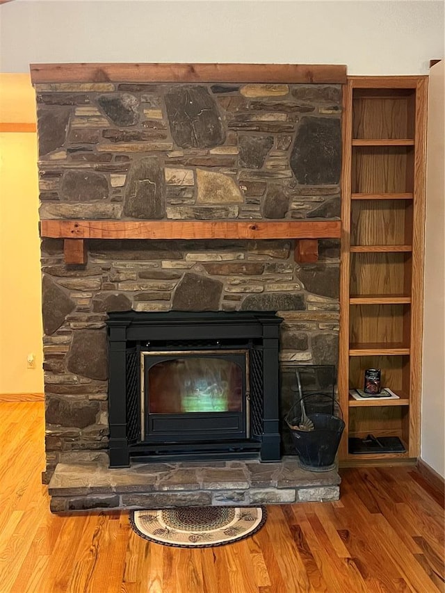 16453 Scenic Ridge Rd, Marthasville, MO 63357 - detailed view of a fireplace, wood finished floors, and baseboards