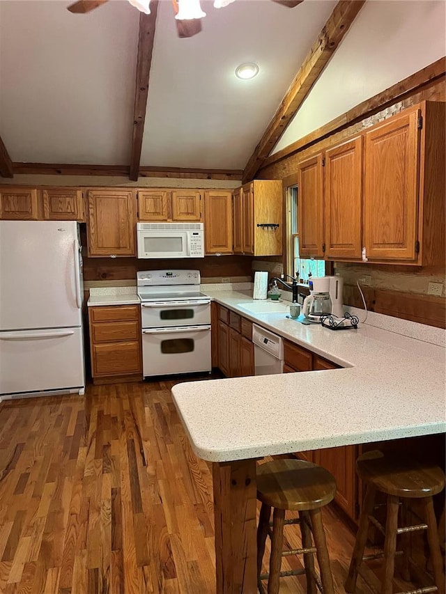 16453 Scenic Ridge Rd, Marthasville, MO 63357 - kitchen featuring white appliances, a sink, a peninsula, brown cabinetry, and dark wood finished floors