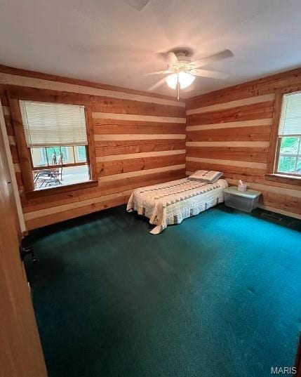 16453 Scenic Ridge Rd, Marthasville, MO 63357 - unfurnished bedroom with wood walls, carpet flooring, and ceiling fan